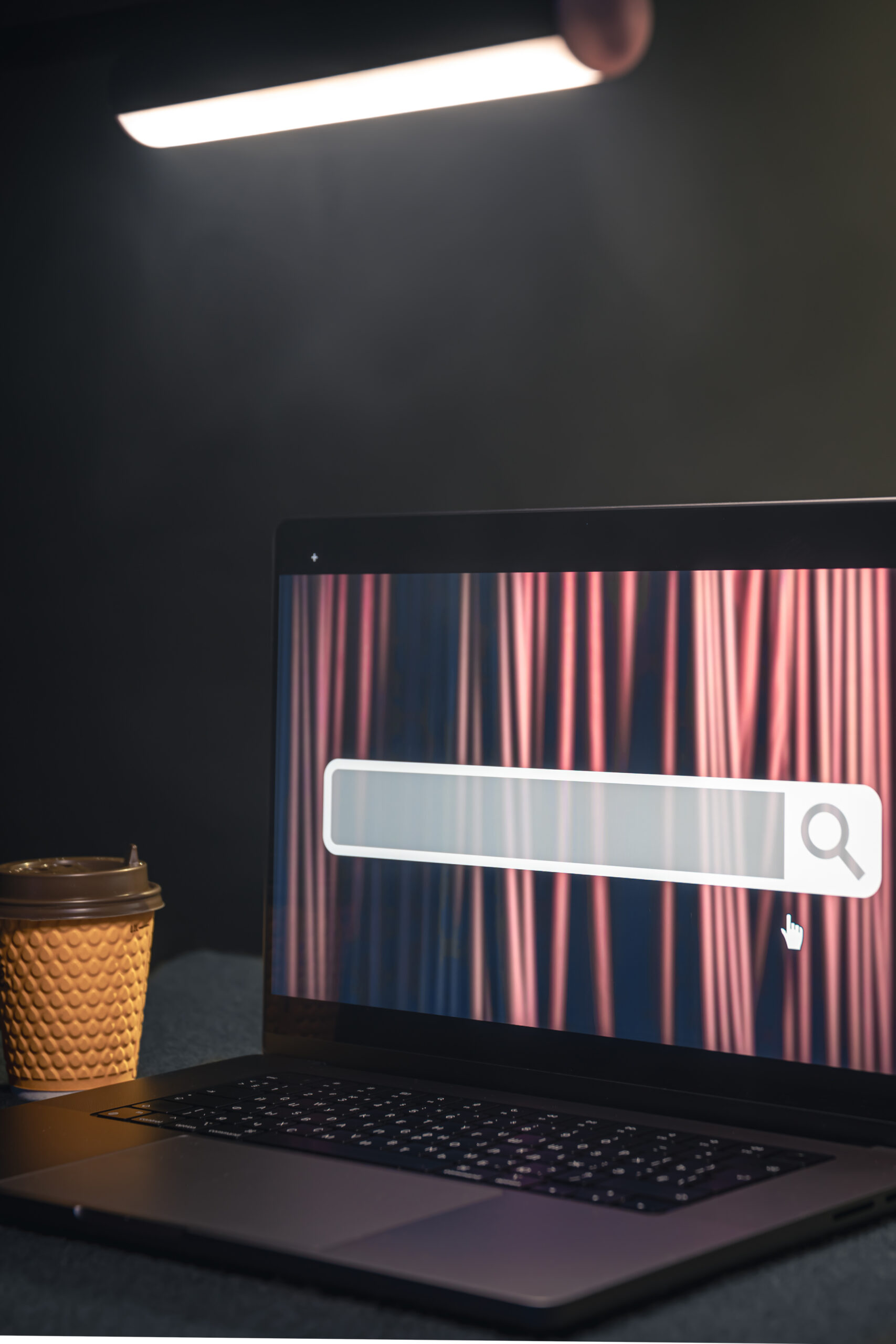 Laptop with internet browser search bar on screen.
